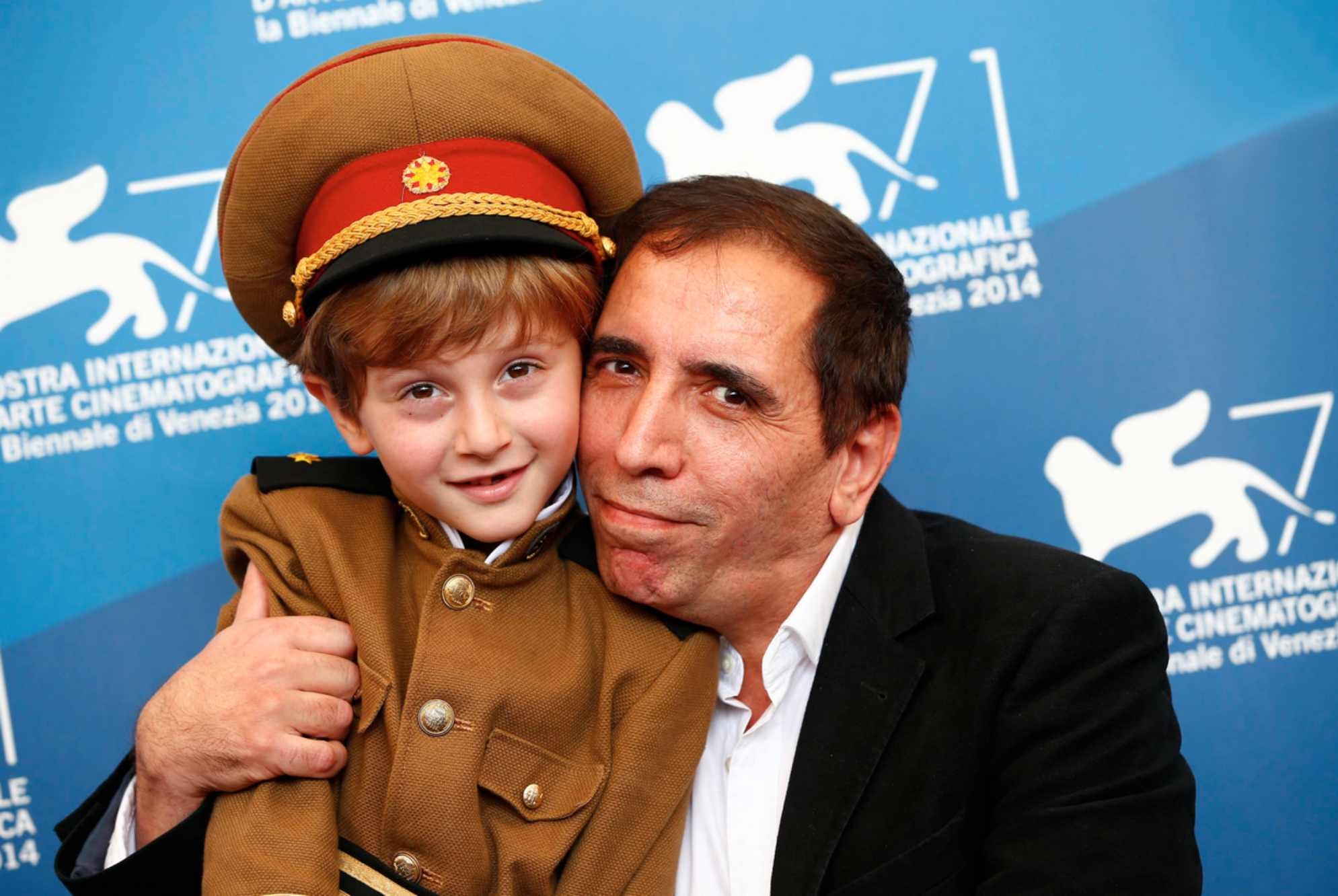 Director Mohsen Makhmalbaf and the young actor Dachi Orvelashvili attend the photocall for the film THE PRESIDENT during the 71st Venice Film Festival 2014